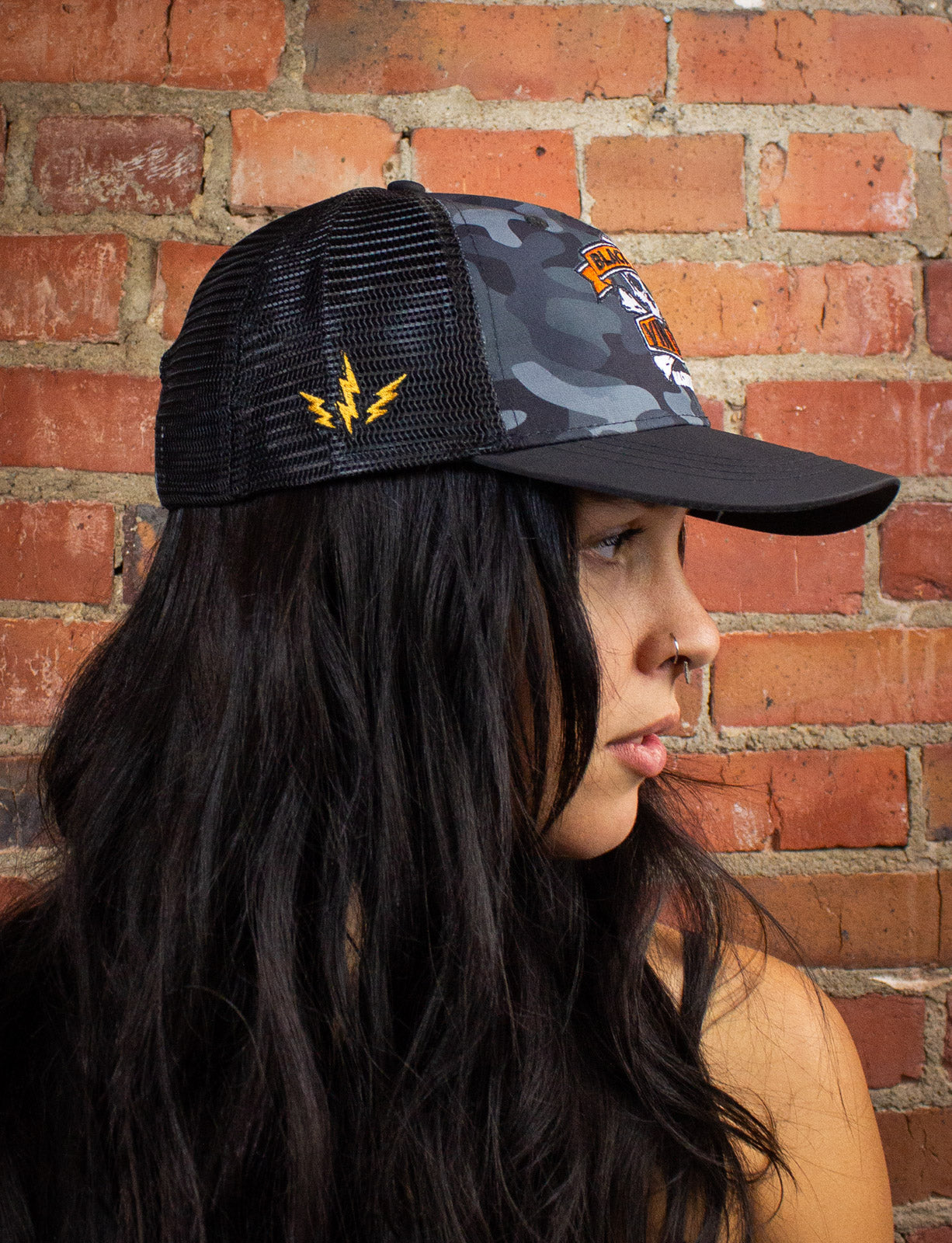 Black Shag Vintage Embroidered Skull + Crossbones Camo Trucker Hat